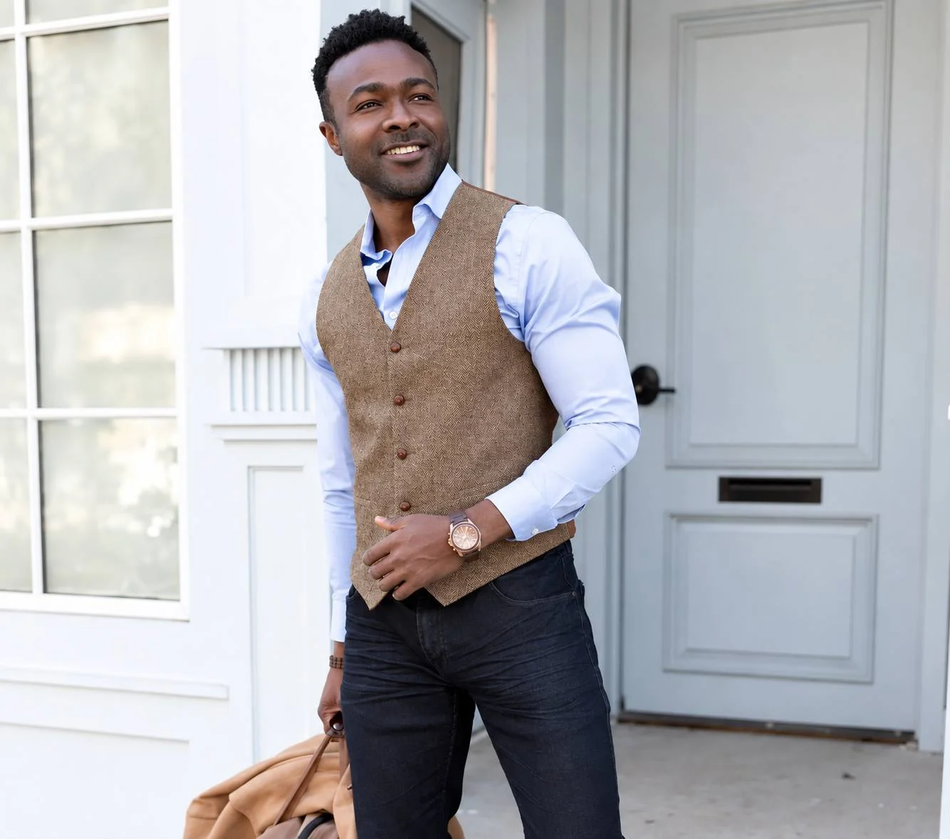 Man wearing the Cream Herringbone Wool Waistcoat styled with a light blue shirt